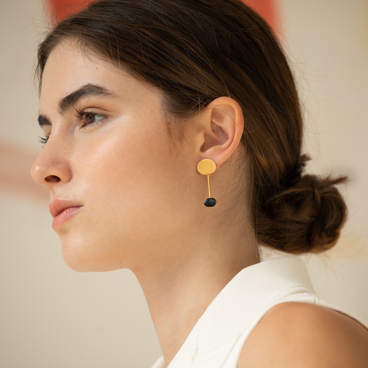 GOLDEN EARRINGS AND BLACK MIRÓ JEWELRY 1