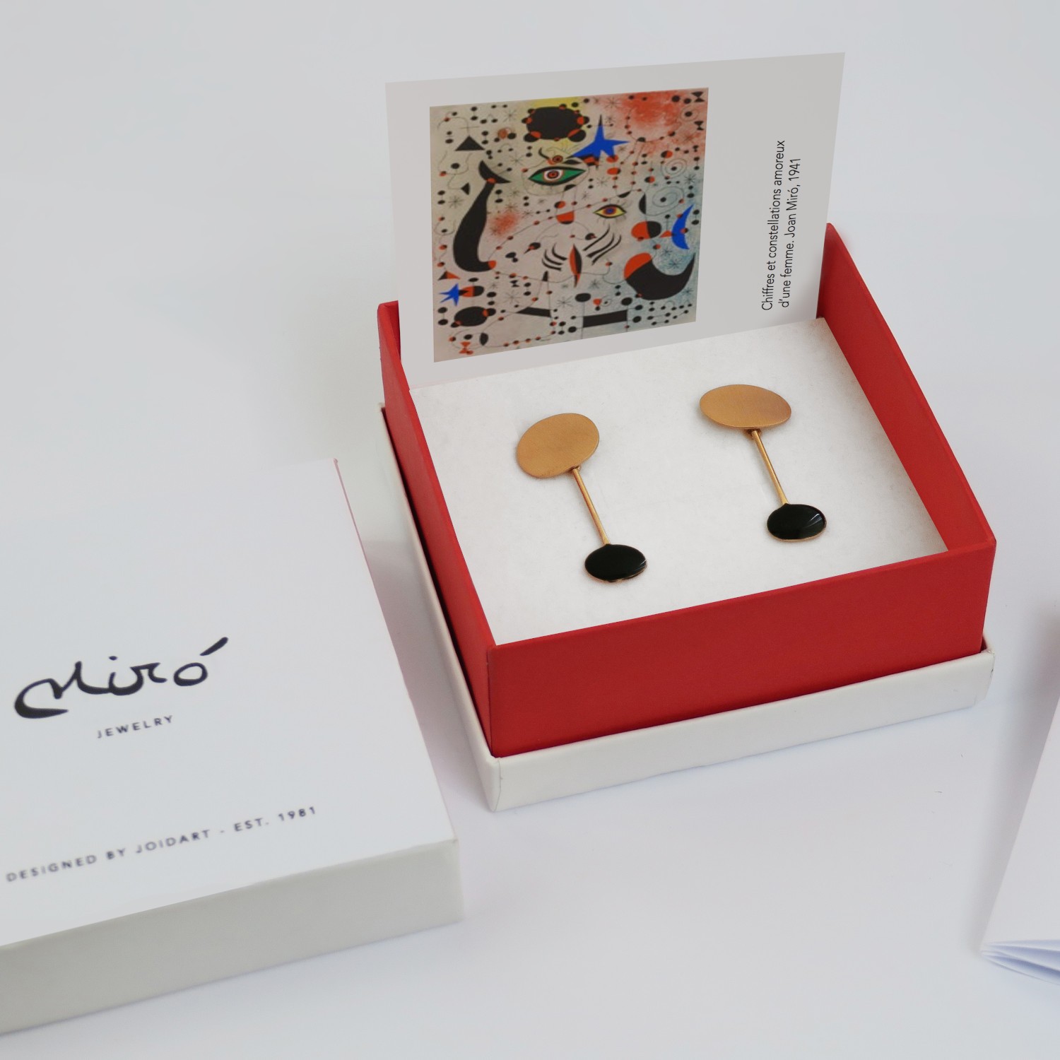 GOLDEN EARRINGS AND BLACK MIRÓ JEWELRY 3